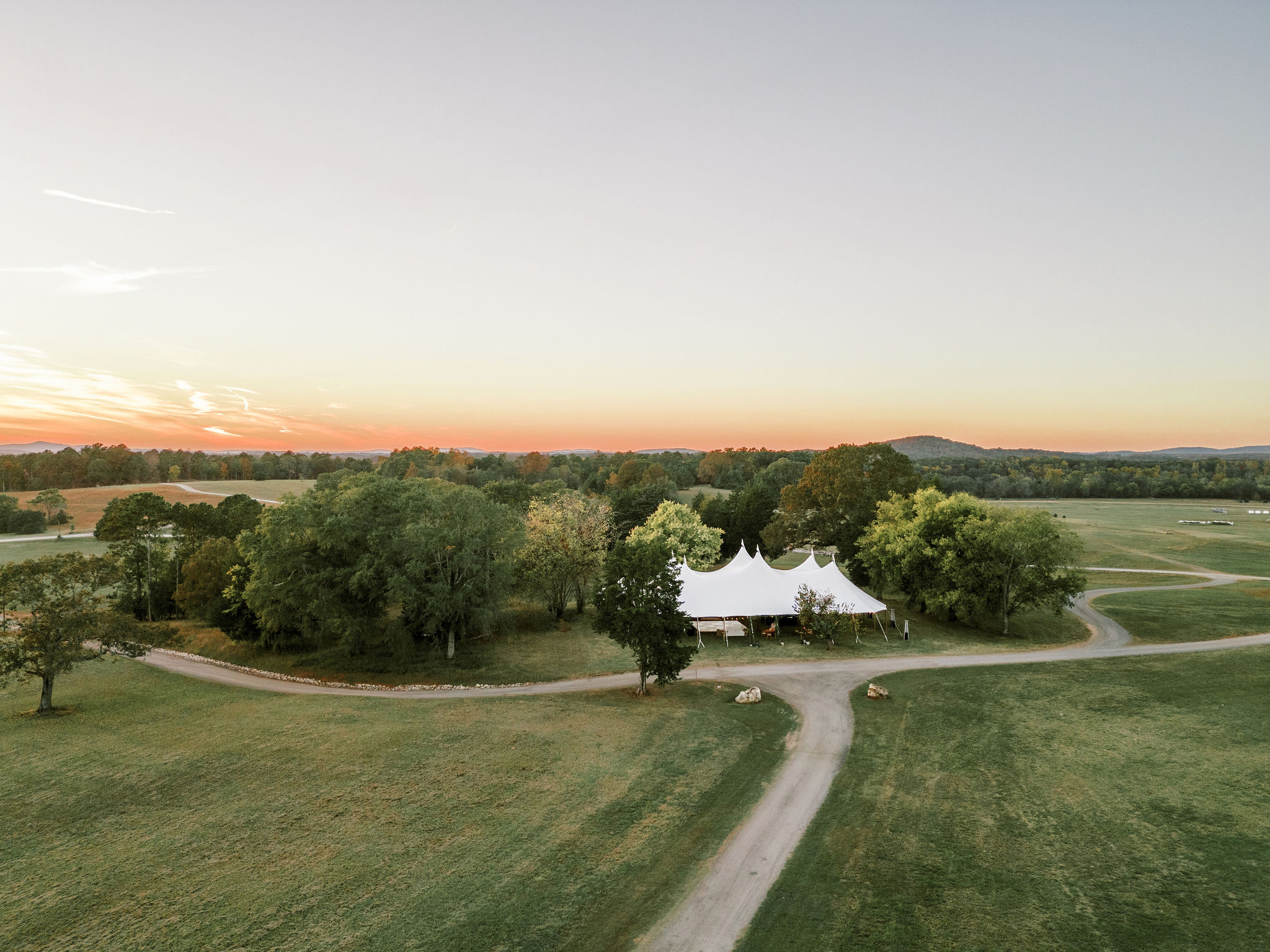 Tented wedding venue at sunset in north Georgia.